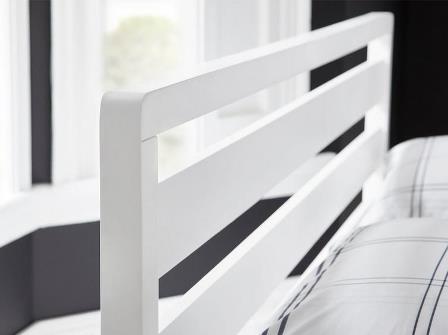 Closeup of dreams woodstock white bed